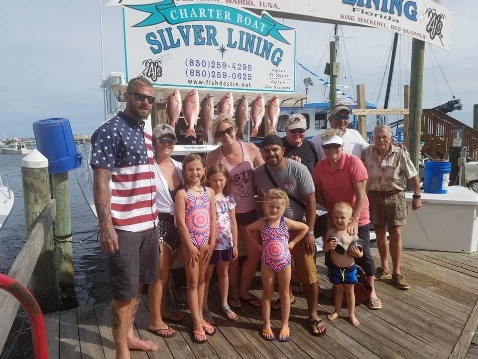620 Corporation family members gathered on a marina dock